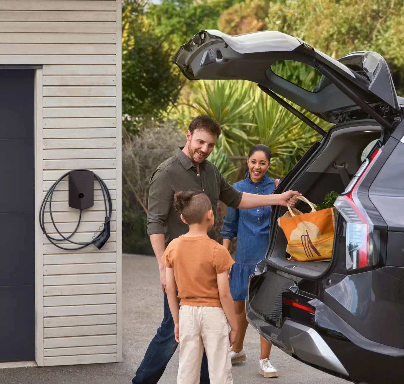 Evnex EV charger installed at a home — family with electric vehicle